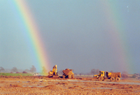 rainbow over quarrying machinery