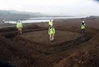 Excavation team after complete excavation of square barrow