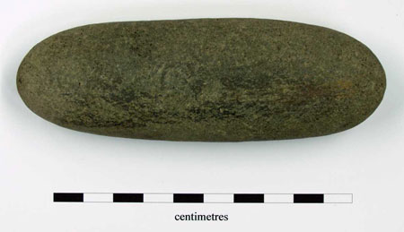 Complete oblong whetstone. Metallic residues visible on all sides. 119 x 39 x 27mm